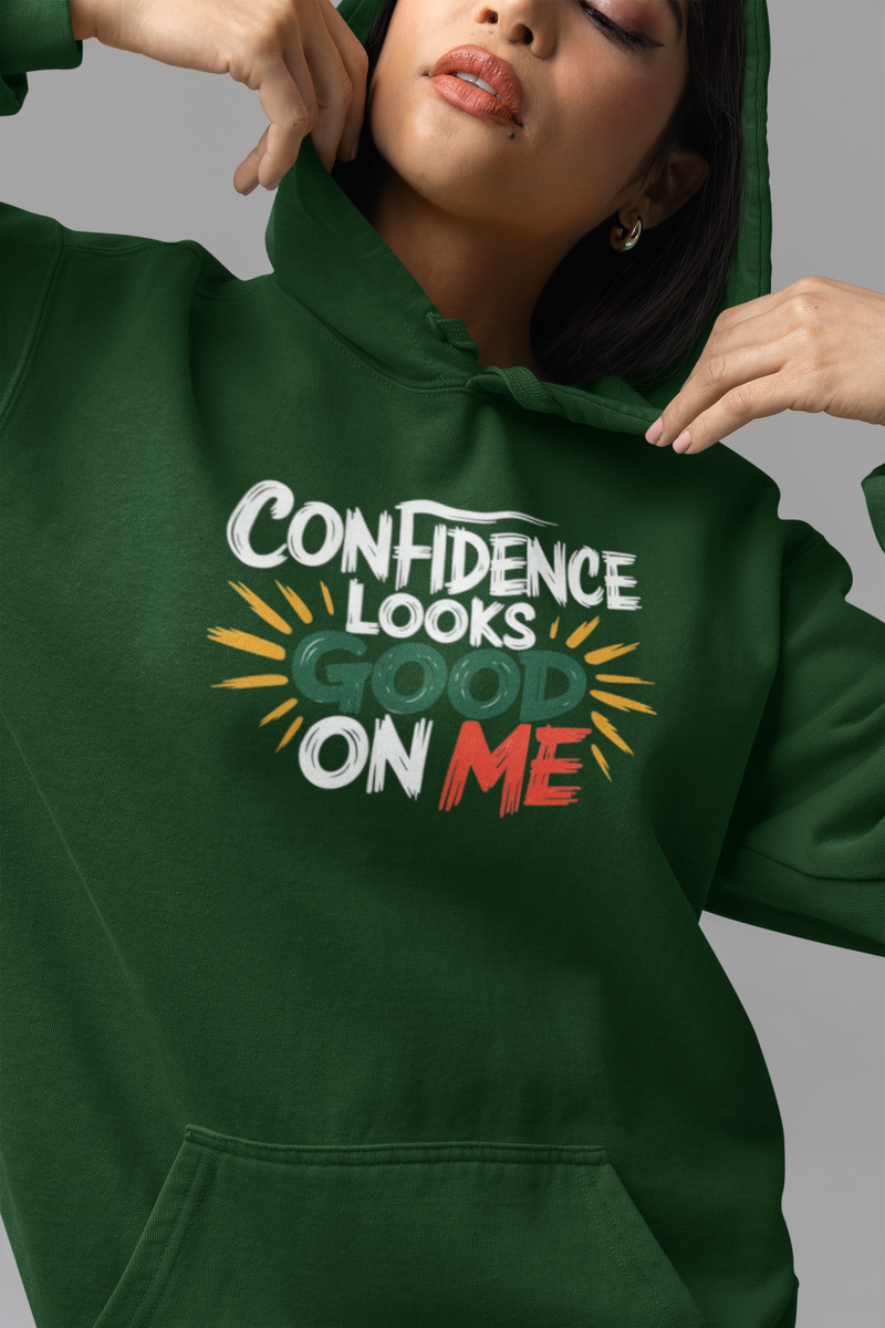 Confident woman in a minimalist sweatshirt reflecting on her journey with a self-love clothing brand.